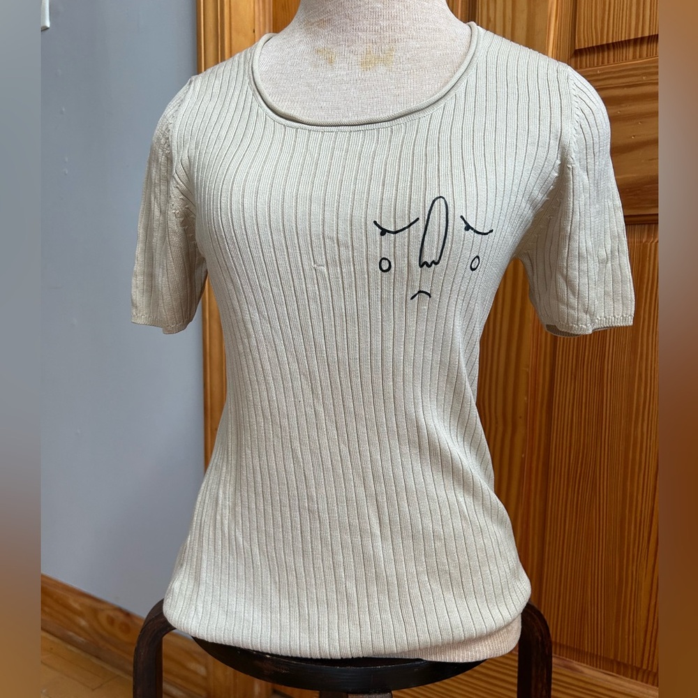 Cream Ribbed Women's Top with Graphic Design